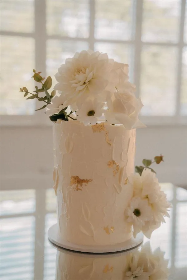 White with Gold Leaf Buttercream Wedding Cake with White Flowers and Greenery