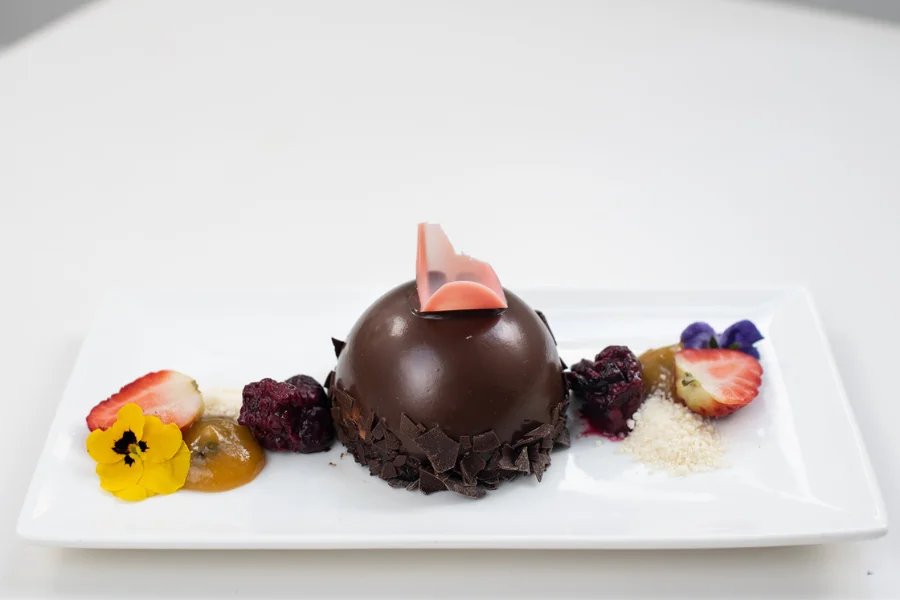 Black Forest Dome (NF) Macerated berries – Passionfruit glaze – Manuka honey flakes Black Forest Dome (NF) Macerated berries – Passionfruit glaze – Manuka honey flakes