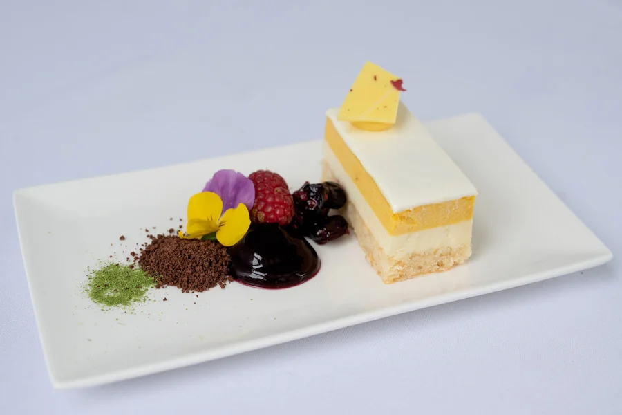 White Chocolate & Mango Mousse (NF) Wild berry glaze – Chocolate soil – Lemongrass powder White Chocolate & Mango Mousse (NF) Wild berry glaze – Chocolate soil – Lemongrass powder