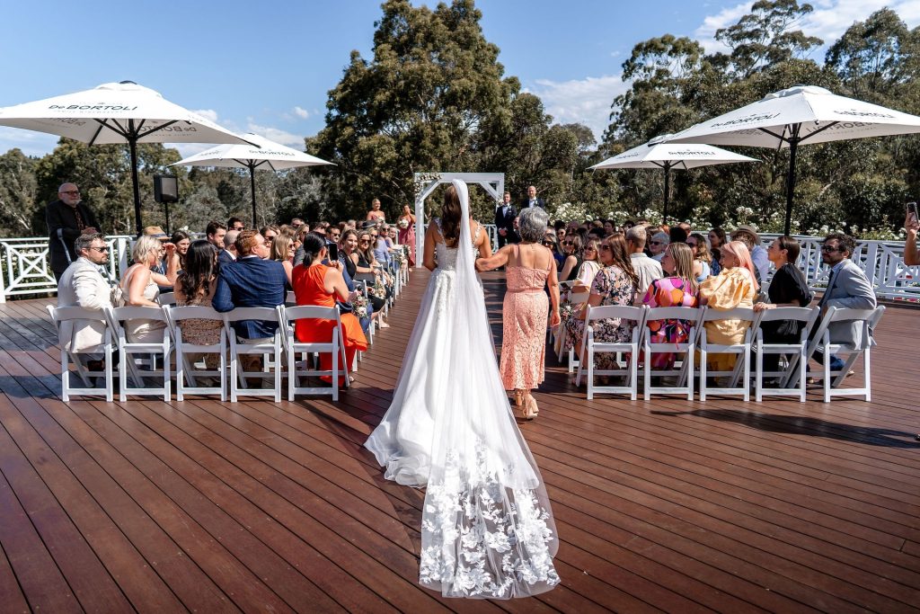 Bramleigh Estate outdoor deck bride walking down aisle at wedding ceremony venue