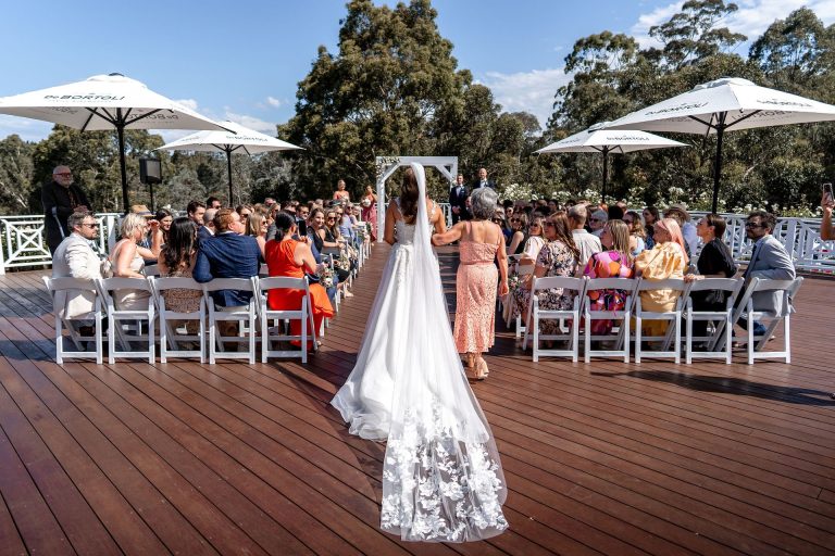 Bramleigh Estate outdoor deck bride walking down aisle at wedding ceremony venue