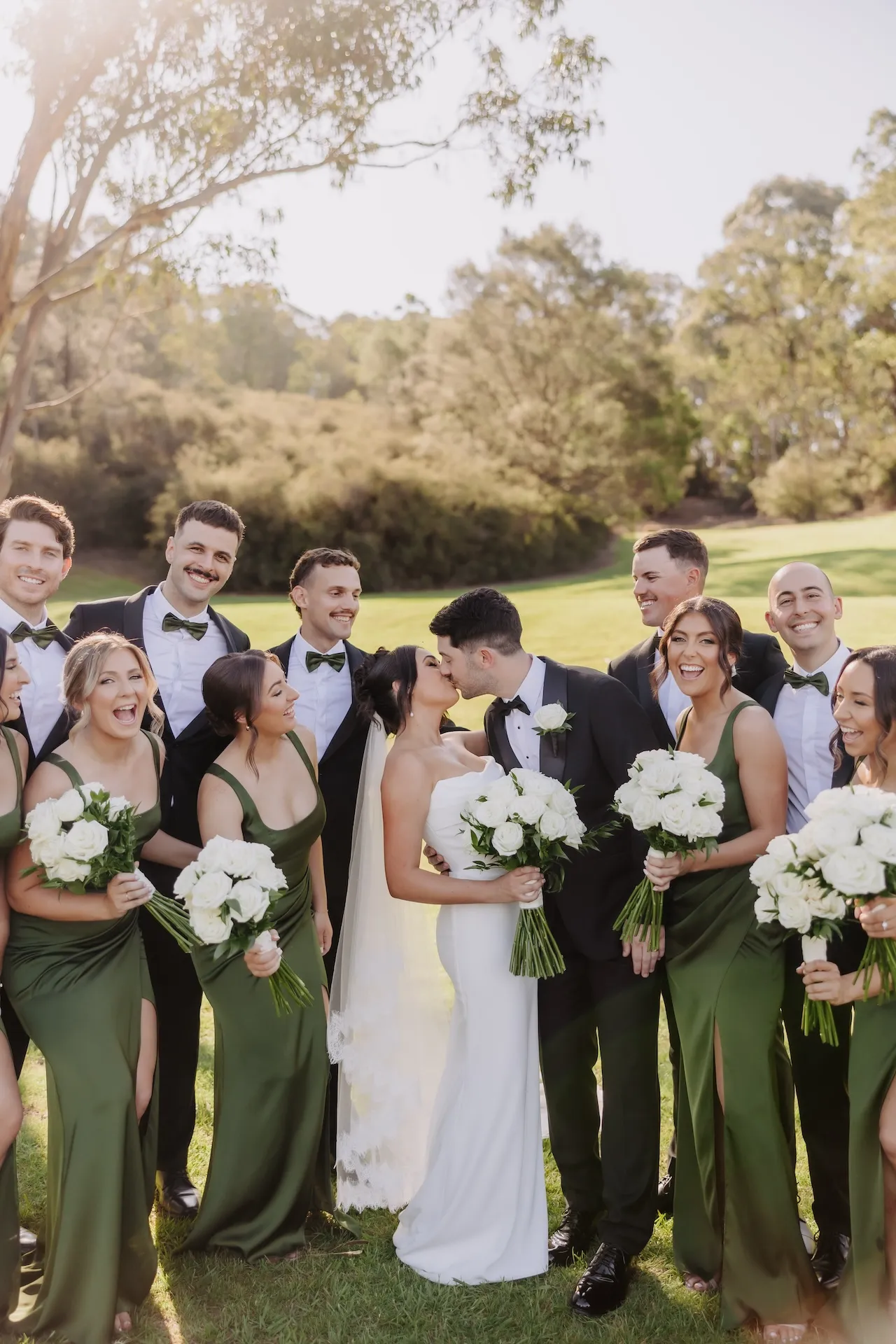 European wedding party with olive green dresses outside at Bramleigh Estate