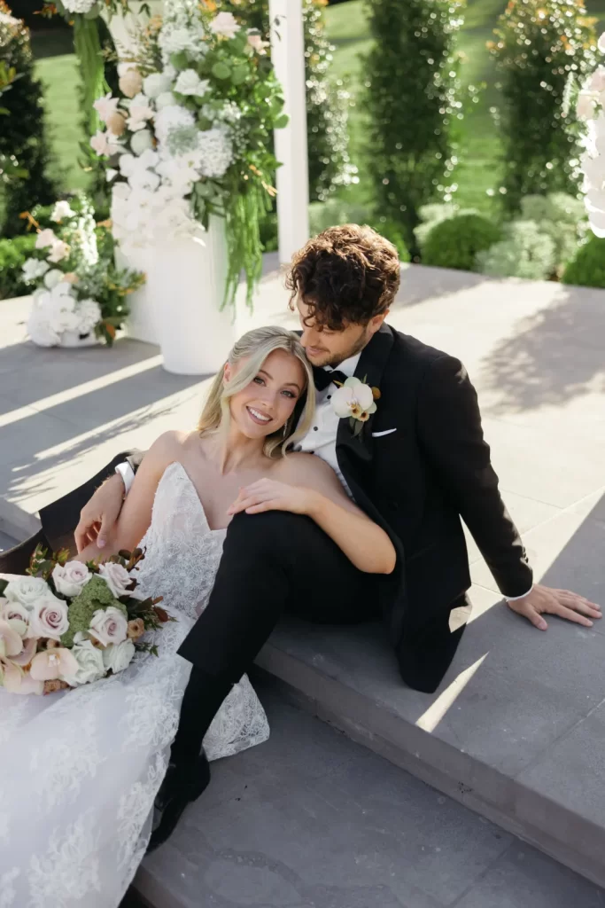 Bride and groom relaxing on the ceremony steps at Bramleigh Estate